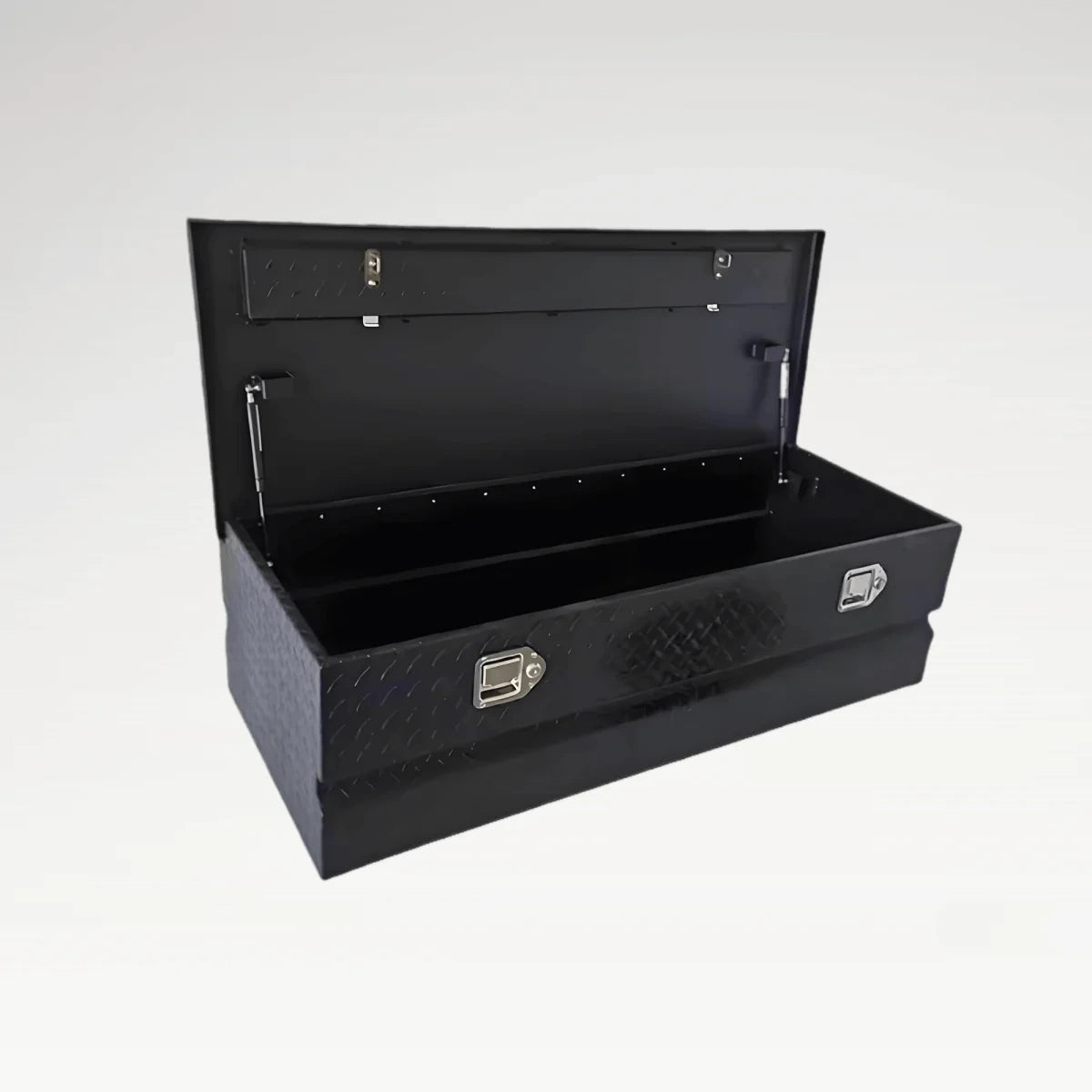 Three-quarter view of open 201008 black diamond plate truck bed storage box