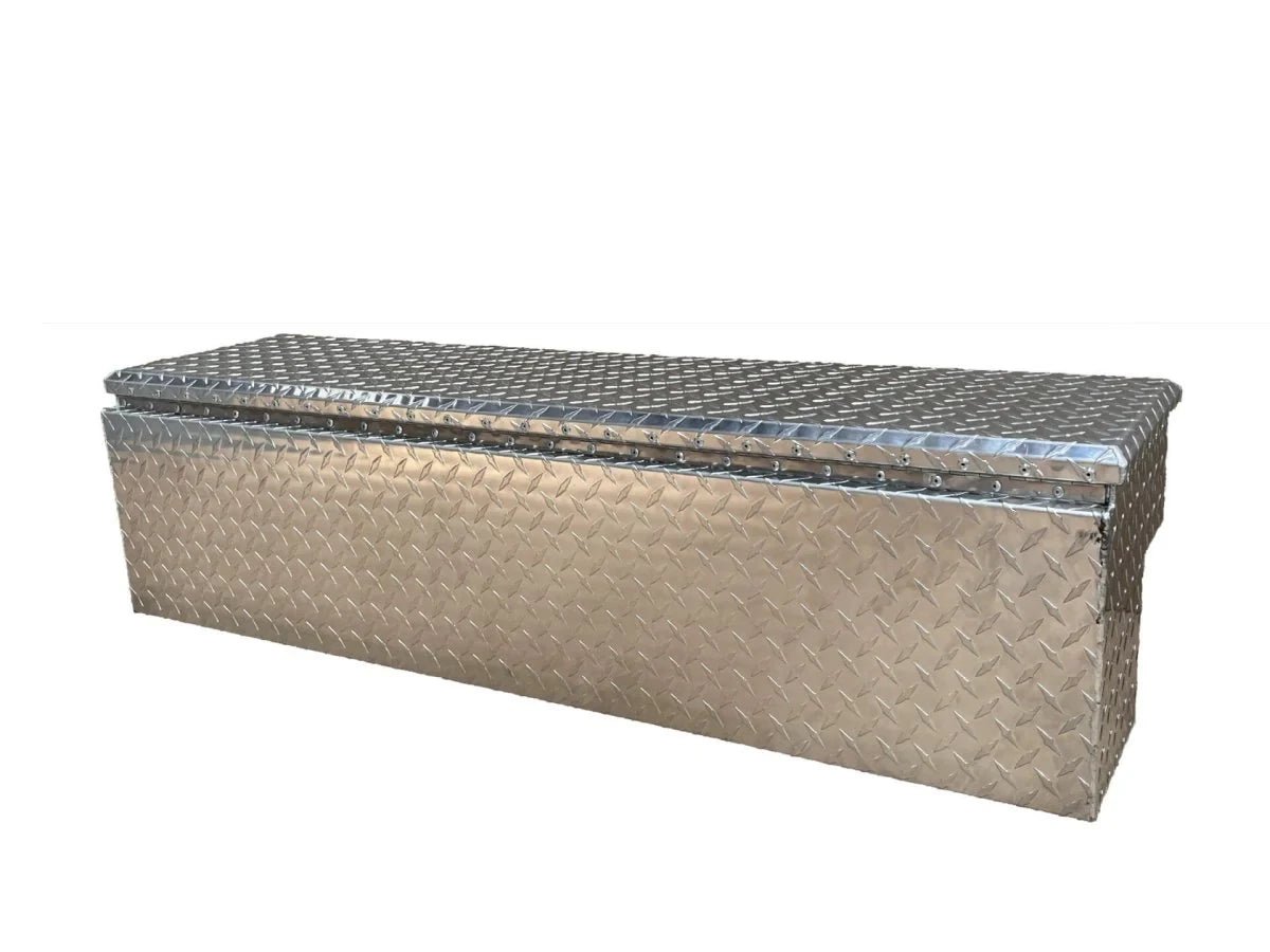 Rear three-quarter view of long closed diamond plate aluminum truck storage box