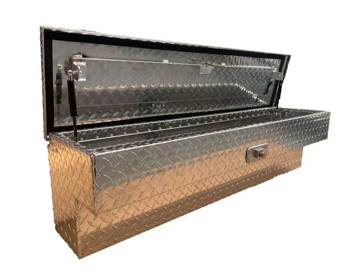 Three-quarter view of open aluminum truck tool box with recessed latch and weather-sealed lid