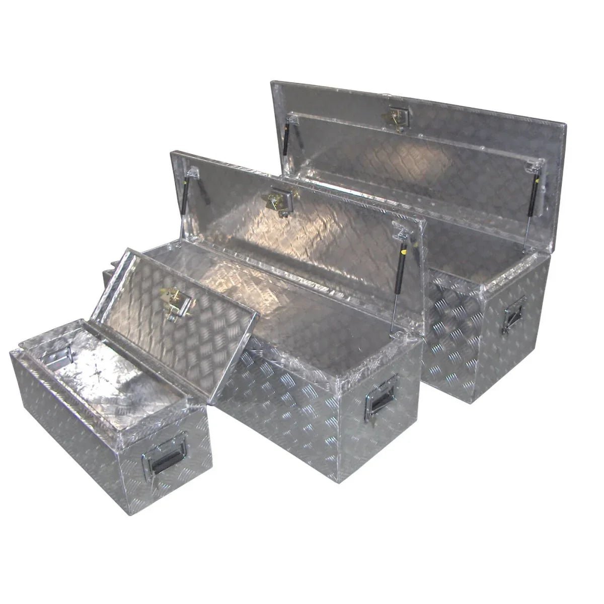 Four open checker plate aluminum truck tool boxes showing deep storage compartments