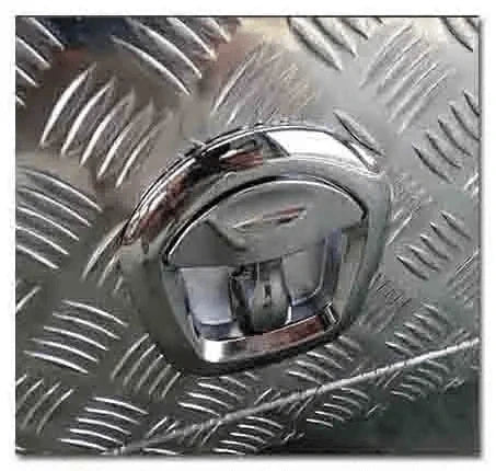 Close-up of recessed locking paddle latch on the 201111 aluminum canopy storage box