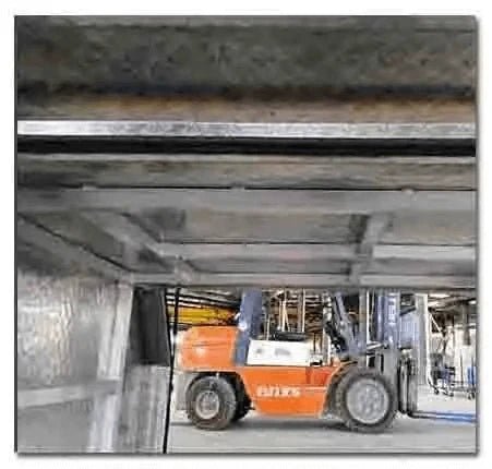 Forklift clearance visible through the reinforced internal frame of the aluminum canopy toolbox