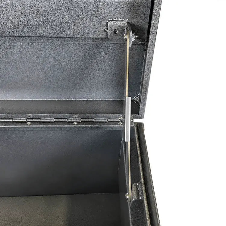 Lid support arm and full-length hinge detail inside the 60-inch steel jobsite storage chest
