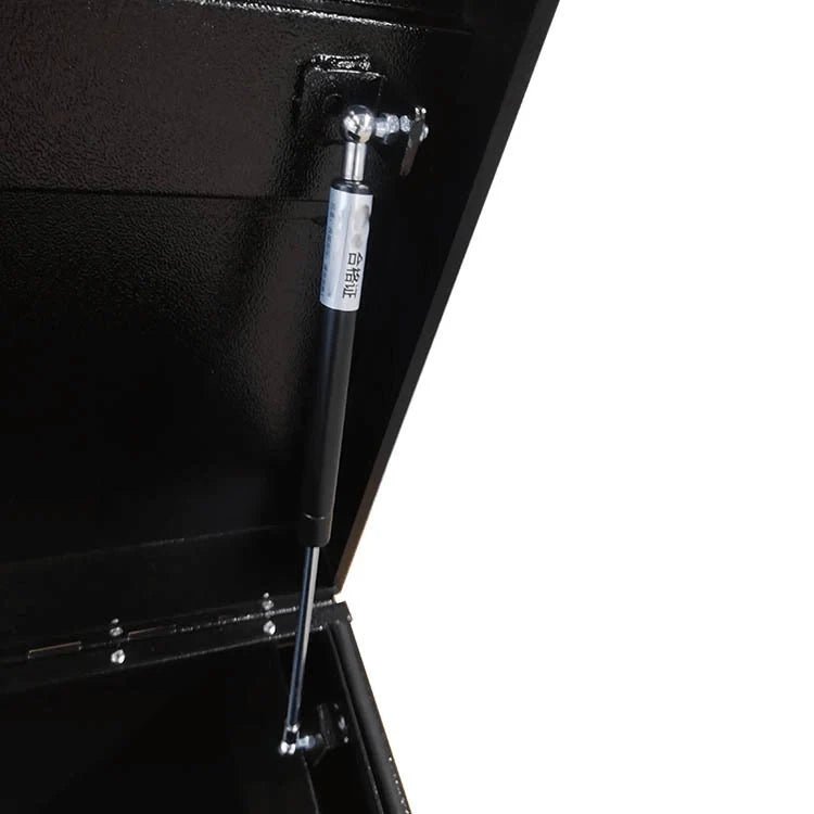 Gas strut detail supporting the lid of the heavy-duty steel construction site tool chest