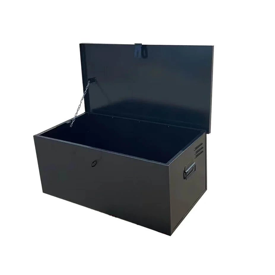 Open black metal truck storage chest with deep interior, lid chain and recessed side handles